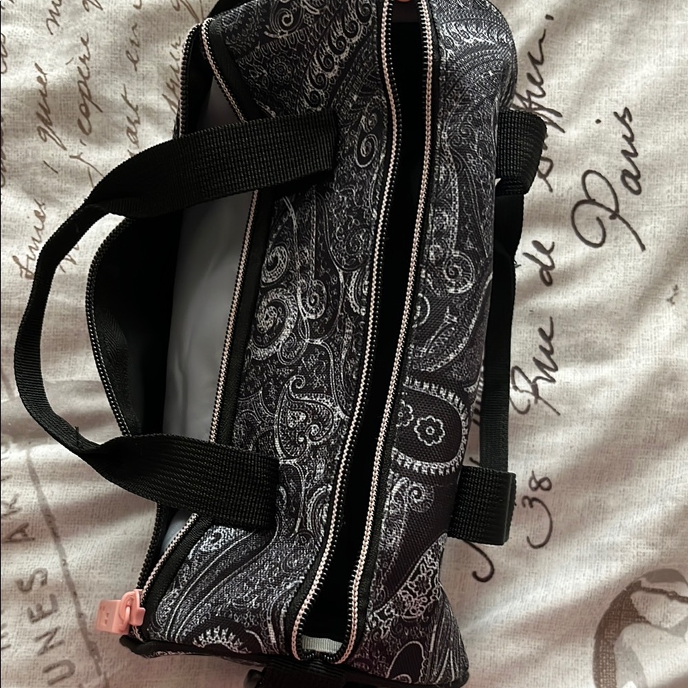 Black and White Duffel Bag with Structured Design and Silver Hardware